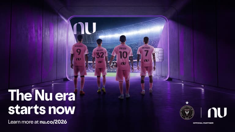 Inter Miami players walk through a tunnel into a lit stadium as part of Nu Stadium campaign