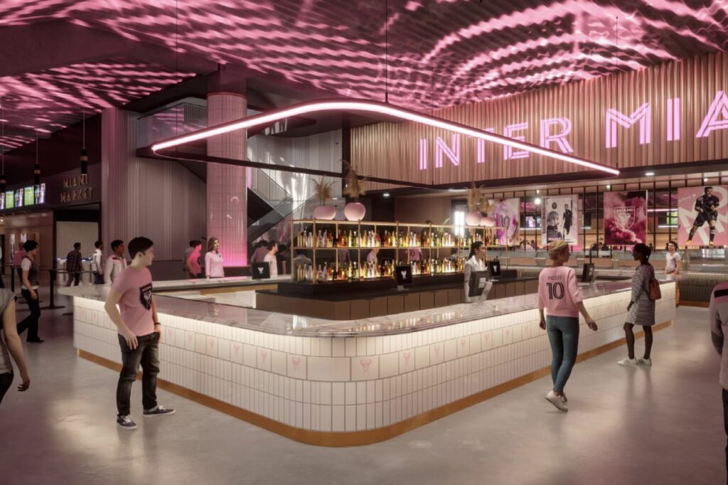 Stadium bar area with Inter Miami signage and pink lighting