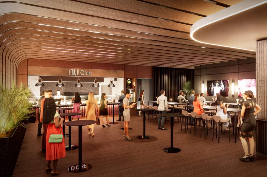 Nu Club lounge interior with bar, seating, and guests inside stadium