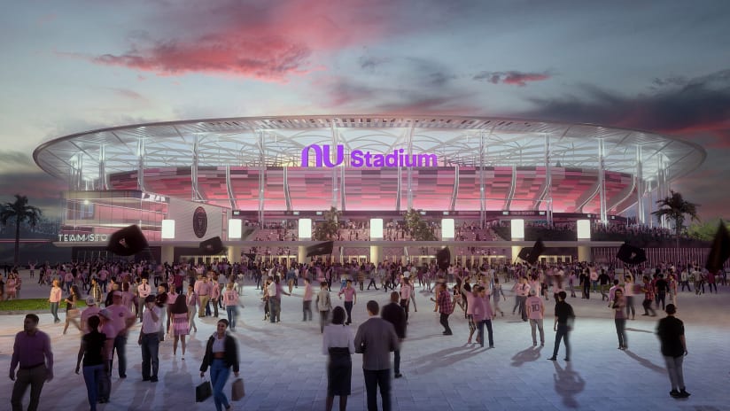 Crowd gathering outside Nu Stadium in Miami at sunset with illuminated facade