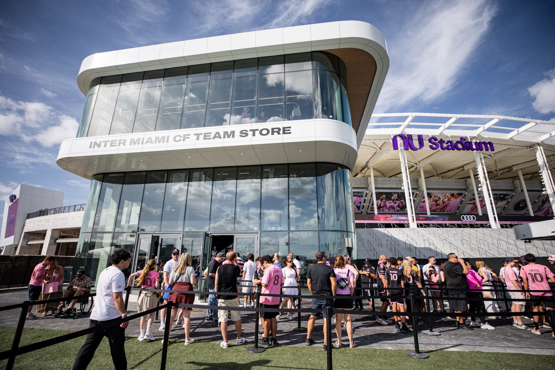 Fans gather outside the Inter Miami CF Team Store at nu Stadium before a soccer match.