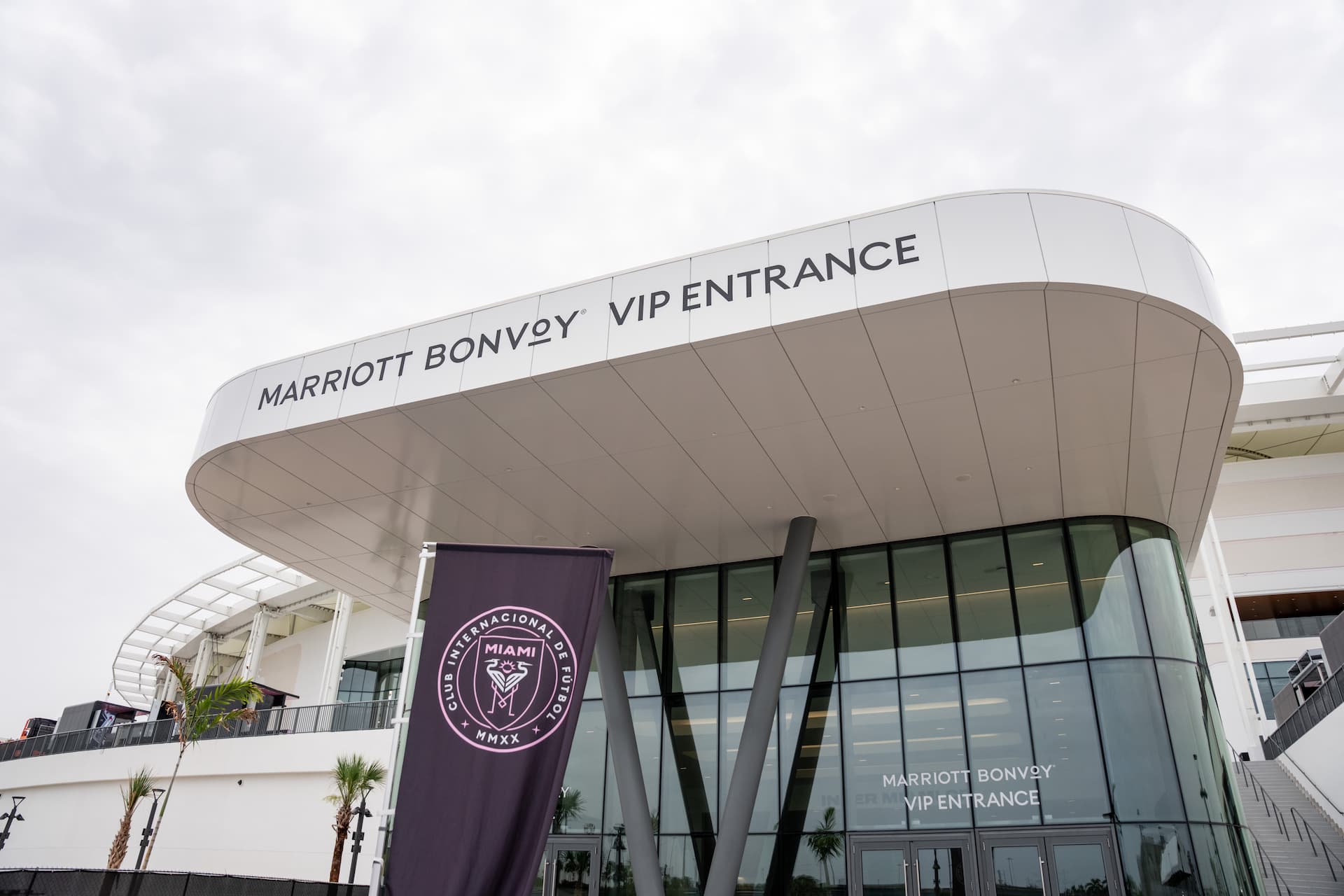 Marriott Bonvoy VIP entrance at NU Stadium featuring a glass facade and Inter Miami CF banner.